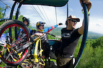 Jill Kintner and Lars Sternberg ride up with Scott on the lift before practice.