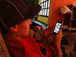 Mark Milward checking out photos Pinkbike Mobile