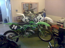 my yz and my kx in the living room testing the boundries. what will she say i wonder when she gets in from work